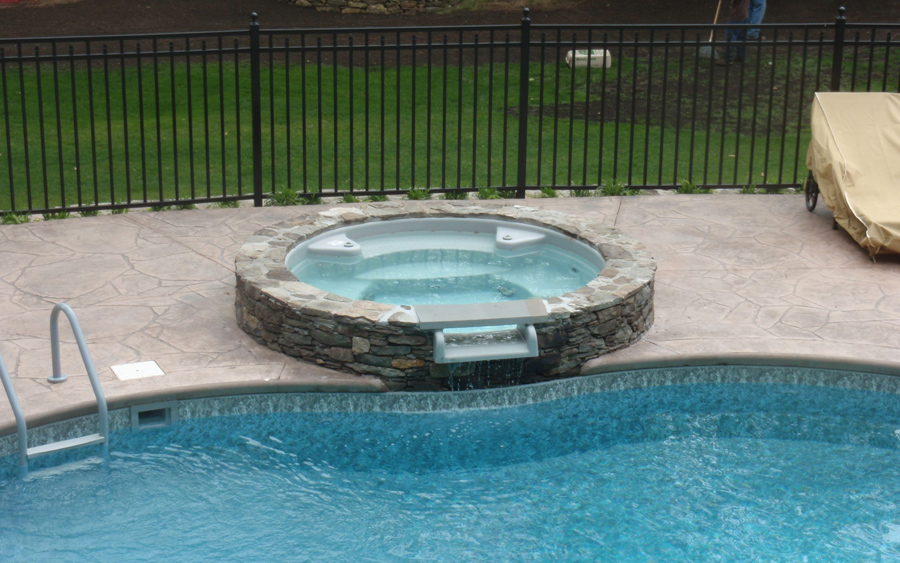 Decorative masonry driveway and hardscape installation at a residential property